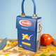 Barilla penne pasta bag on cutting board surrounded by noodles